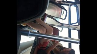 girl flashig on bus legs open