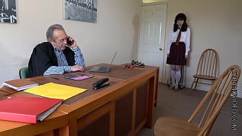 the headmaster canes over the desk